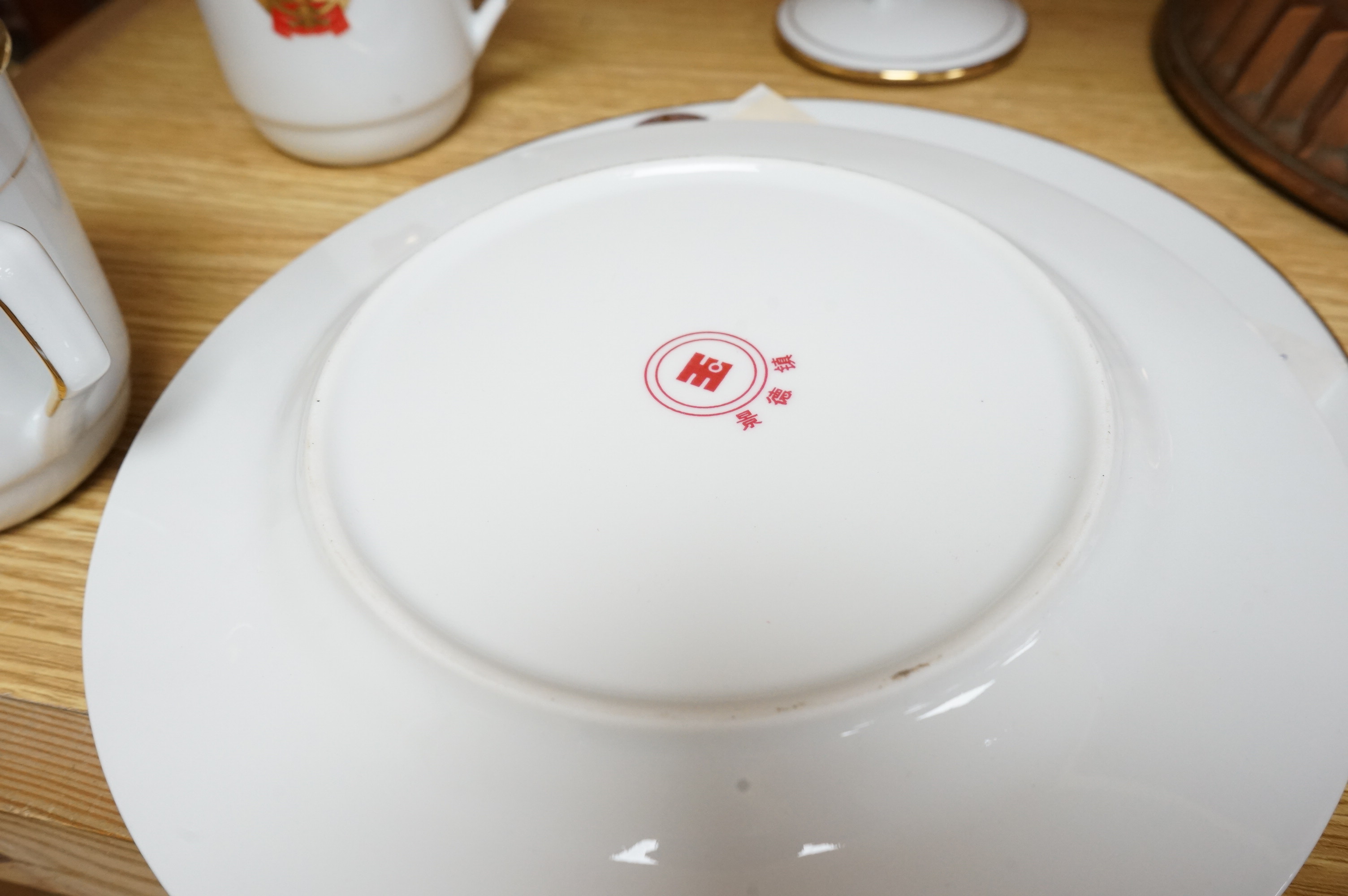 Chinese Communist Party canteen porcelain comprising two cups and two plates, largest 23cm in diameter. Condition - good